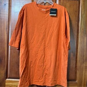 Consensus Men’s rounded collared 100% T-shirt.  Burnt orange in color. Size M